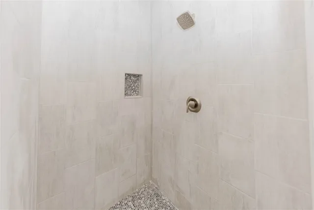 a bathroom with double sink and a mirror