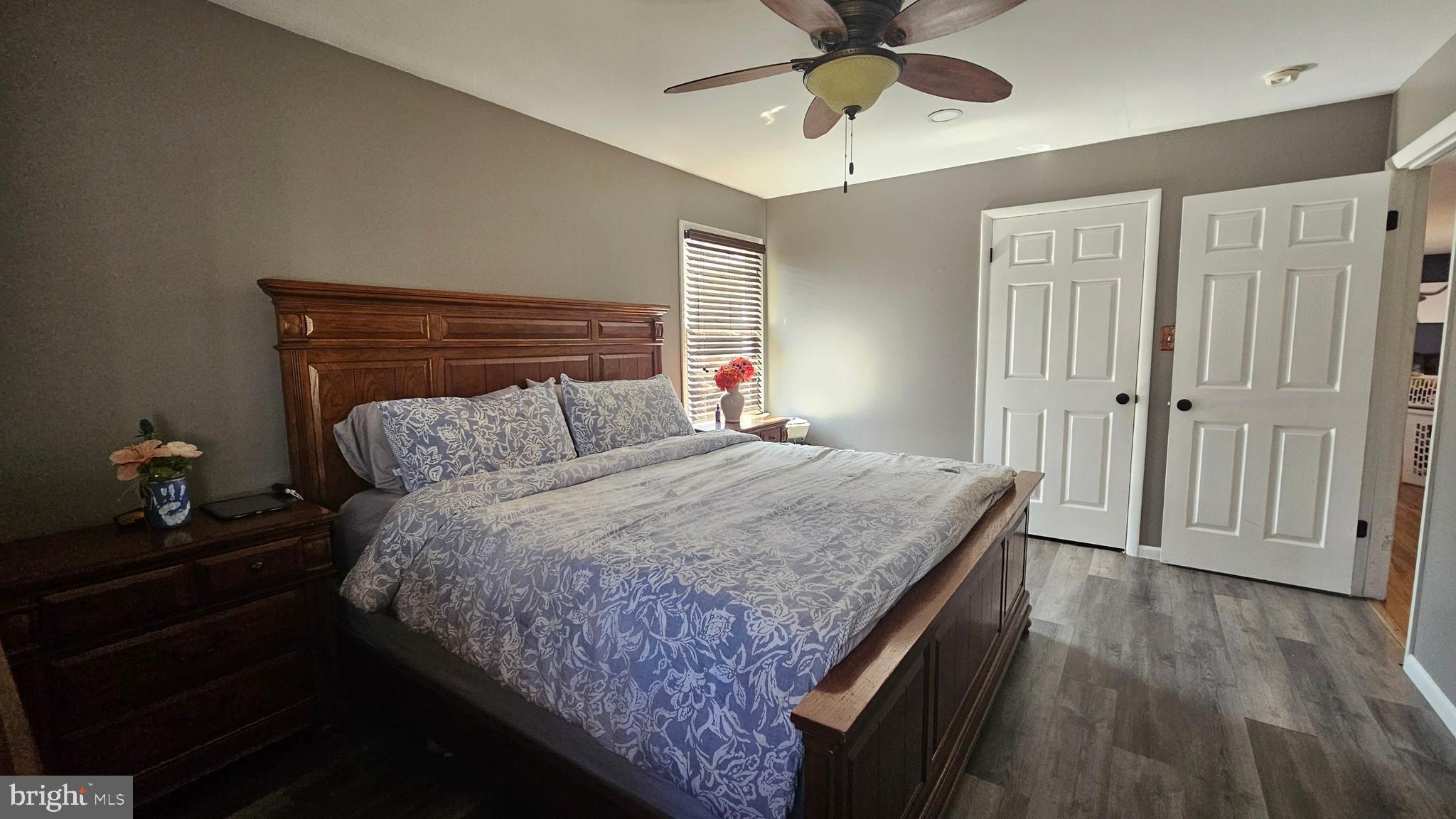 64 Dubois Road Bridgeton, NJ 08302 - Photo 15 of 31 a bedroom with a bed and wooden floor
