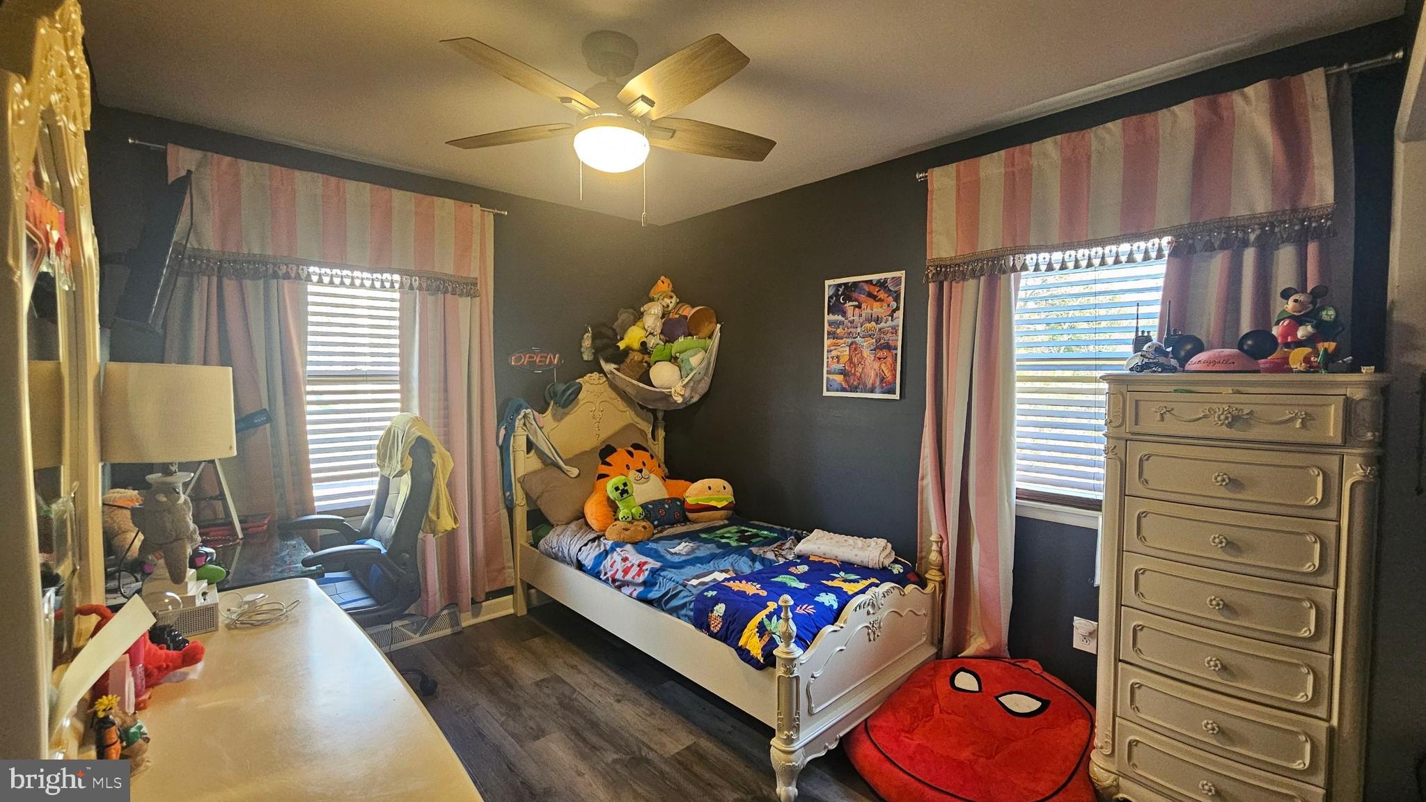 64 Dubois Road Bridgeton, NJ 08302 - Photo 18 of 31 a bedroom with a bed and wooden floor