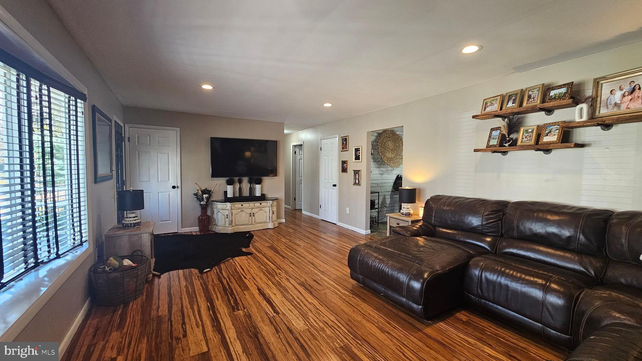 64 Dubois Road Bridgeton, NJ 08302 - Photo 2 of 31 a living room with furniture and a wooden floor