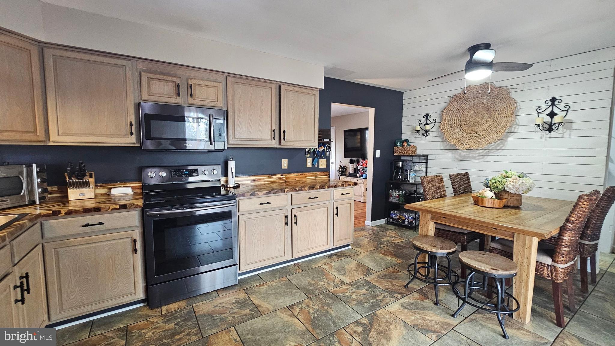 64 Dubois Road Bridgeton, NJ 08302 - Photo 5 of 31 a kitchen with a white cabinets and appliances