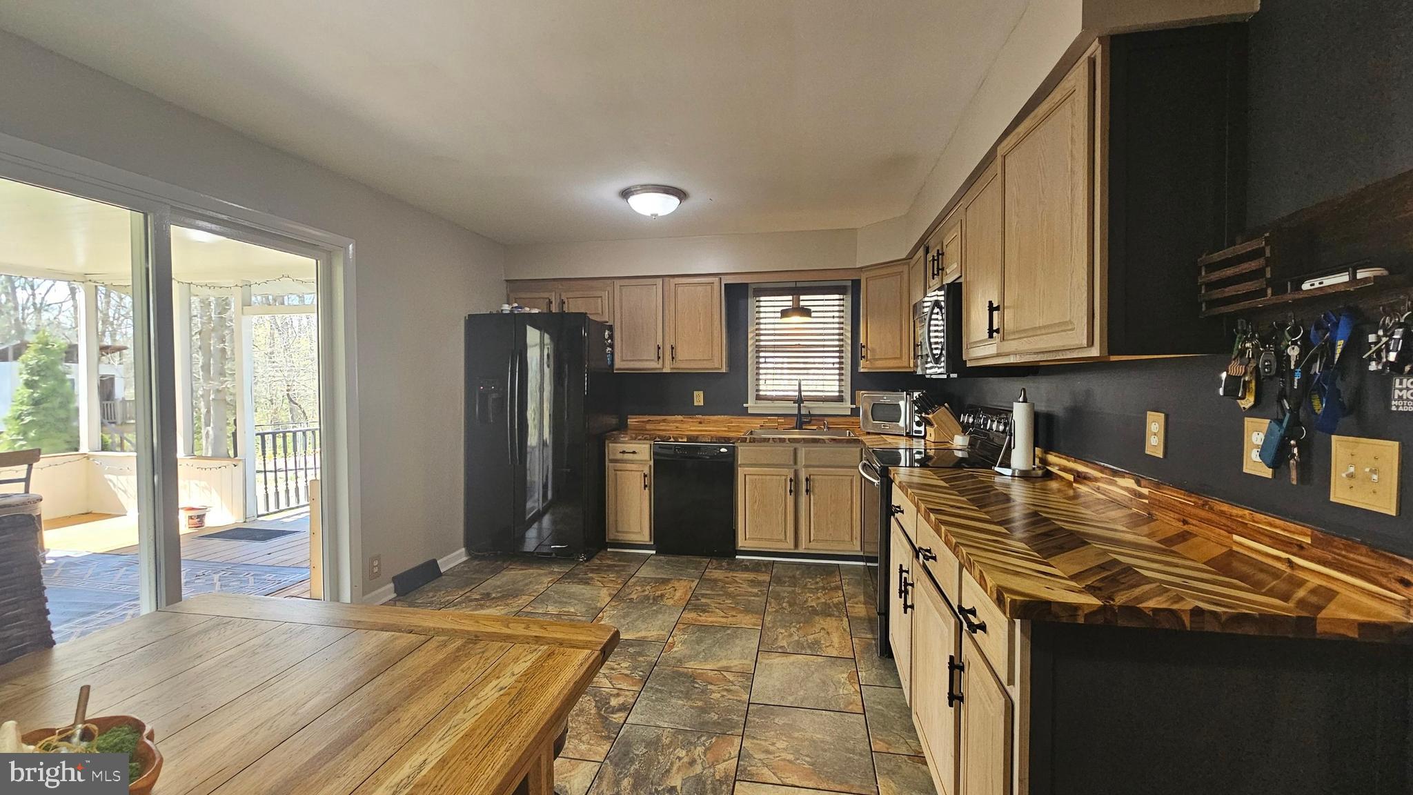 64 Dubois Road Bridgeton, NJ 08302 - Photo 7 of 31 a kitchen with a sink cabinets and stainless steel appliances