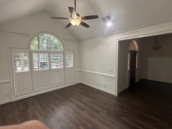 wooden floor in an empty room with a window