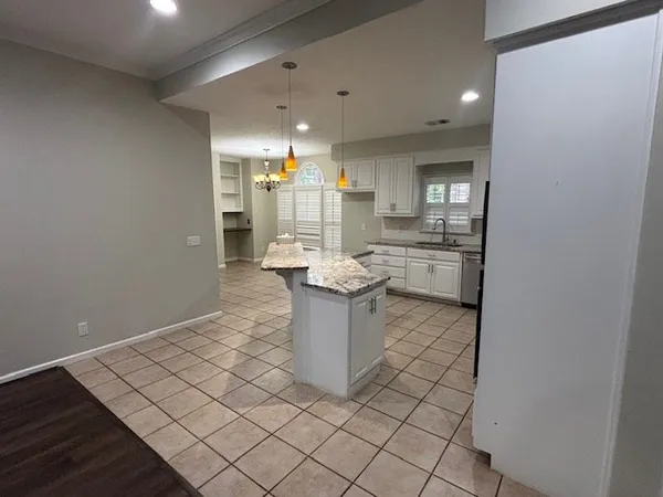 a kitchen with a sink and cabinets