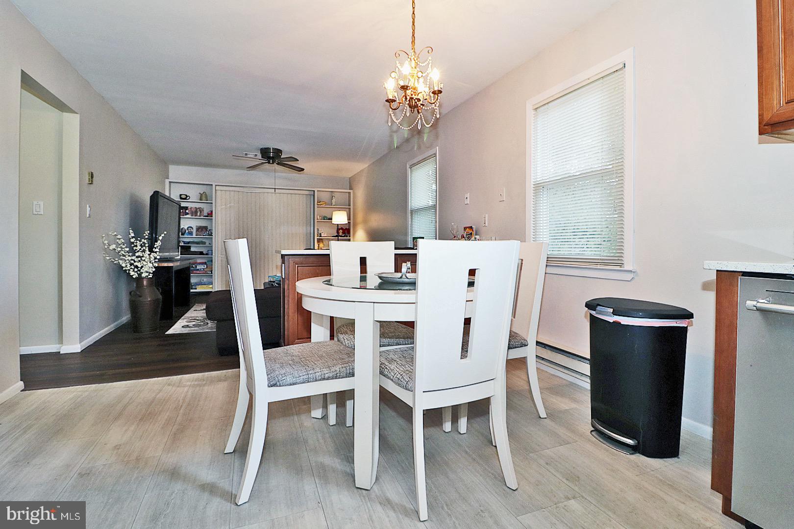 23 Abbey Road Brick, NJ 08723 - Photo 12 of 37 a view of a dining room with furniture window and wooden floor