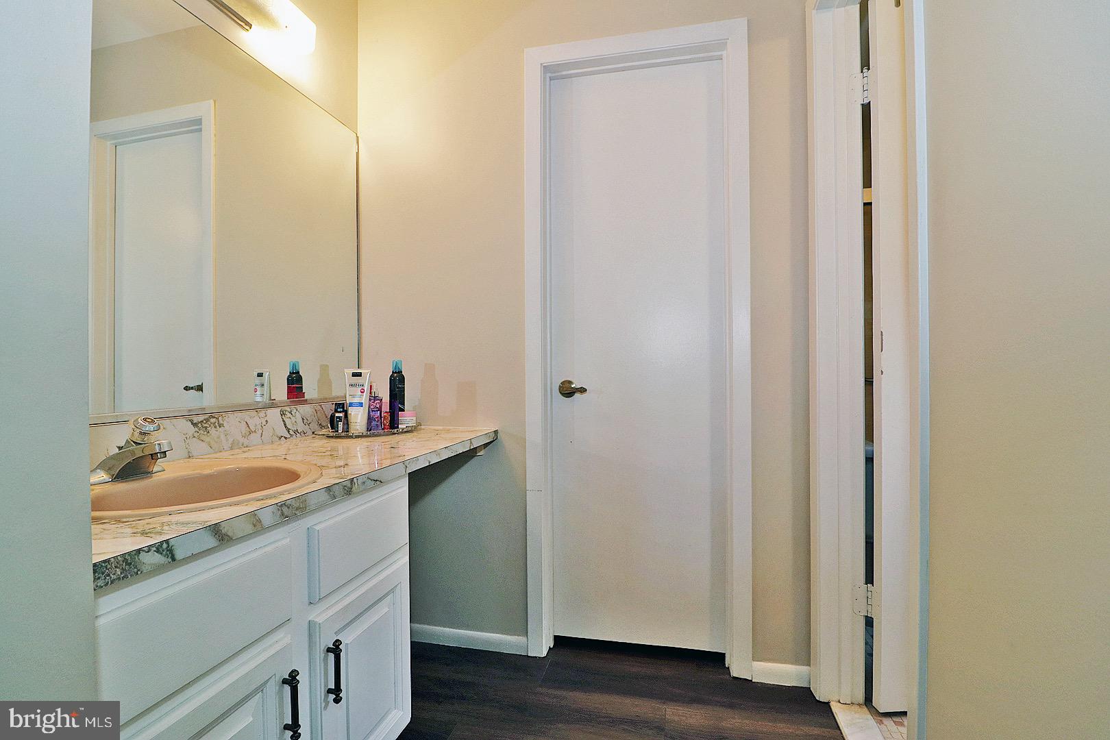 23 Abbey Road Brick, NJ 08723 - Photo 17 of 37 a bathroom with a granite countertop sink and a mirror
