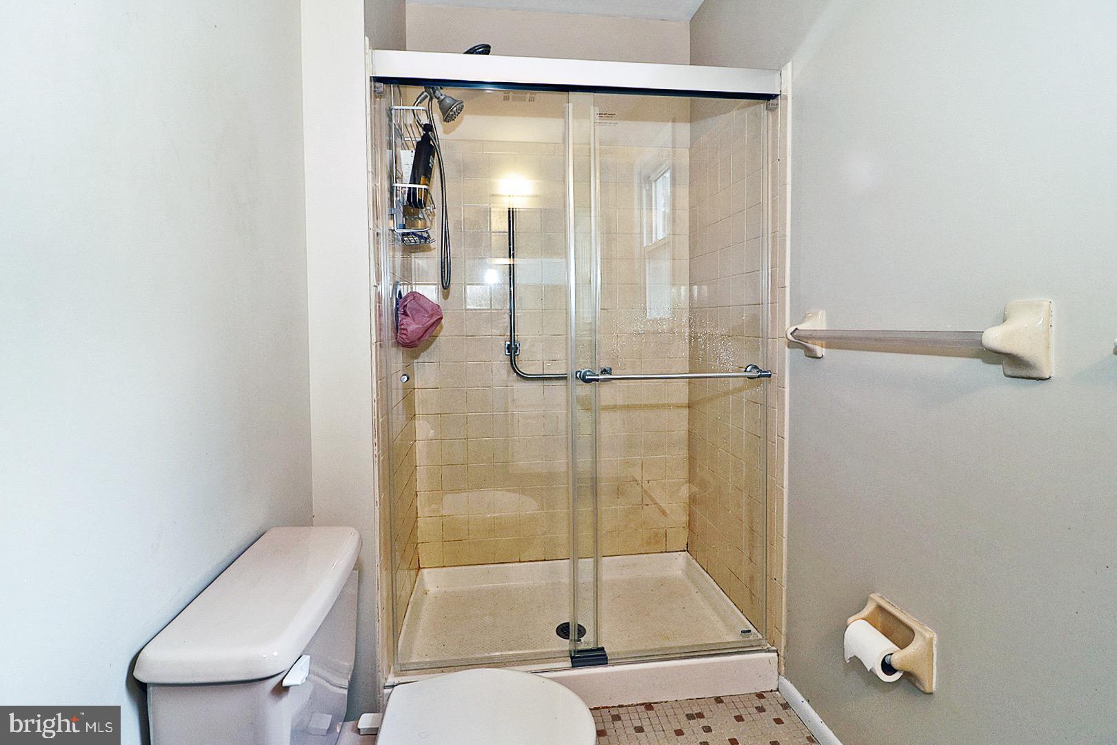 23 Abbey Road Brick, NJ 08723 - Photo 18 of 37 a bathroom with a shower and toilet