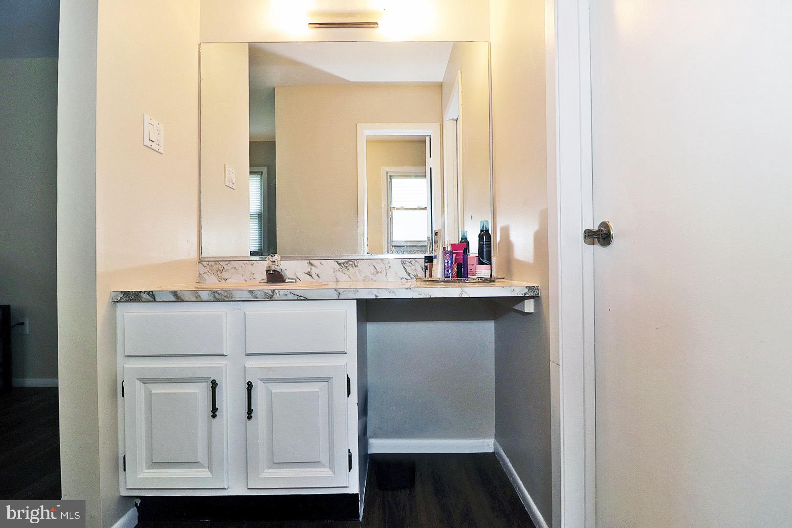 23 Abbey Road Brick, NJ 08723 - Photo 20 of 37 a bathroom with a sink and a mirror