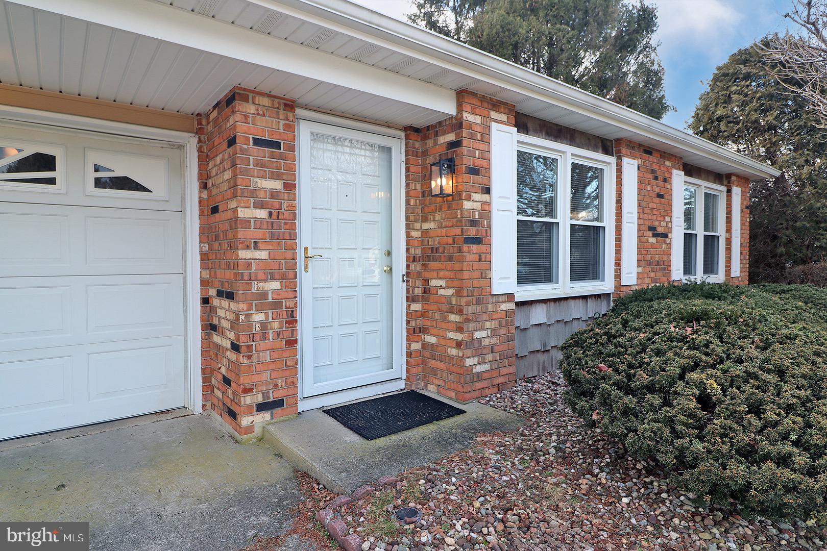 23 Abbey Road Brick, NJ 08723 - Photo 2 of 37 front view of a house with a window