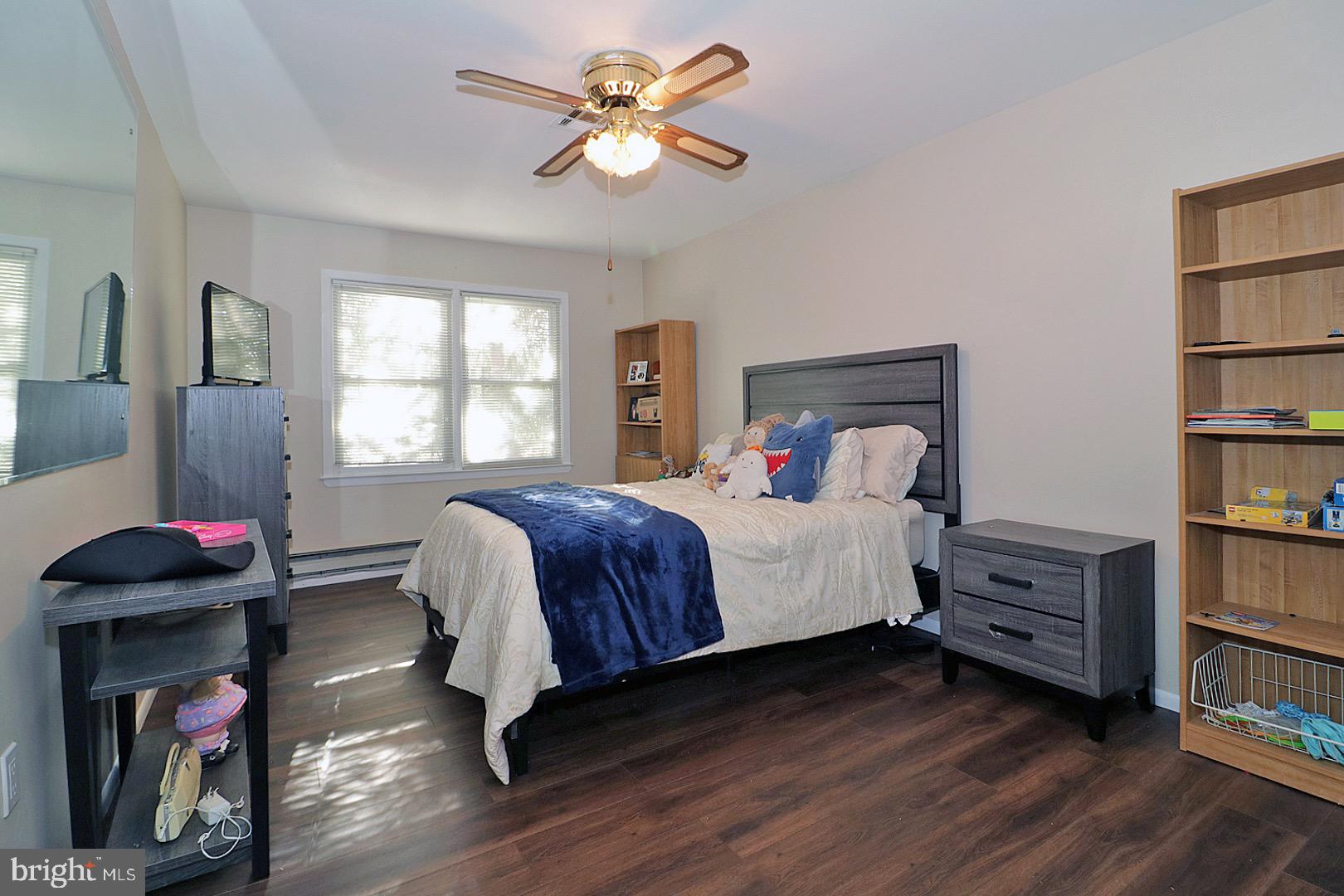 23 Abbey Road Brick, NJ 08723 - Photo 21 of 37 a bedroom with a bed and a book shelf
