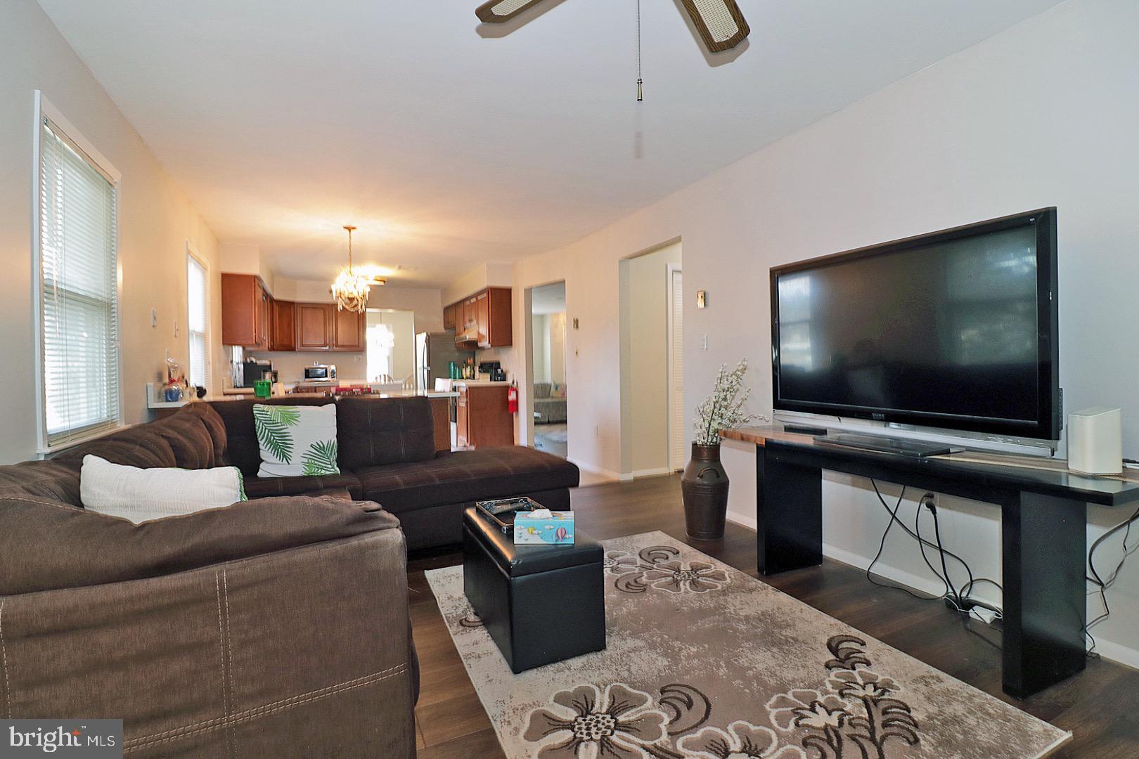 23 Abbey Road Brick, NJ 08723 - Photo 28 of 37 a living room with furniture and a flat screen tv