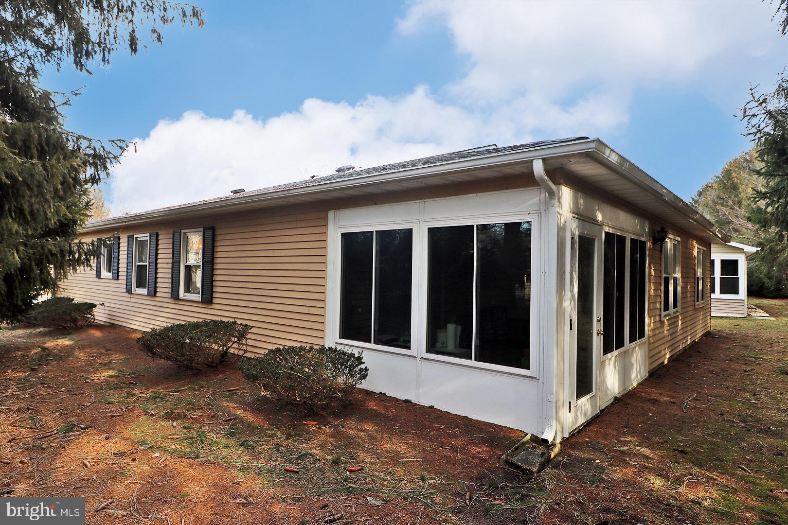 23 Abbey Road Brick, NJ 08723 - Photo 32 of 37 a front view of a house with parking space