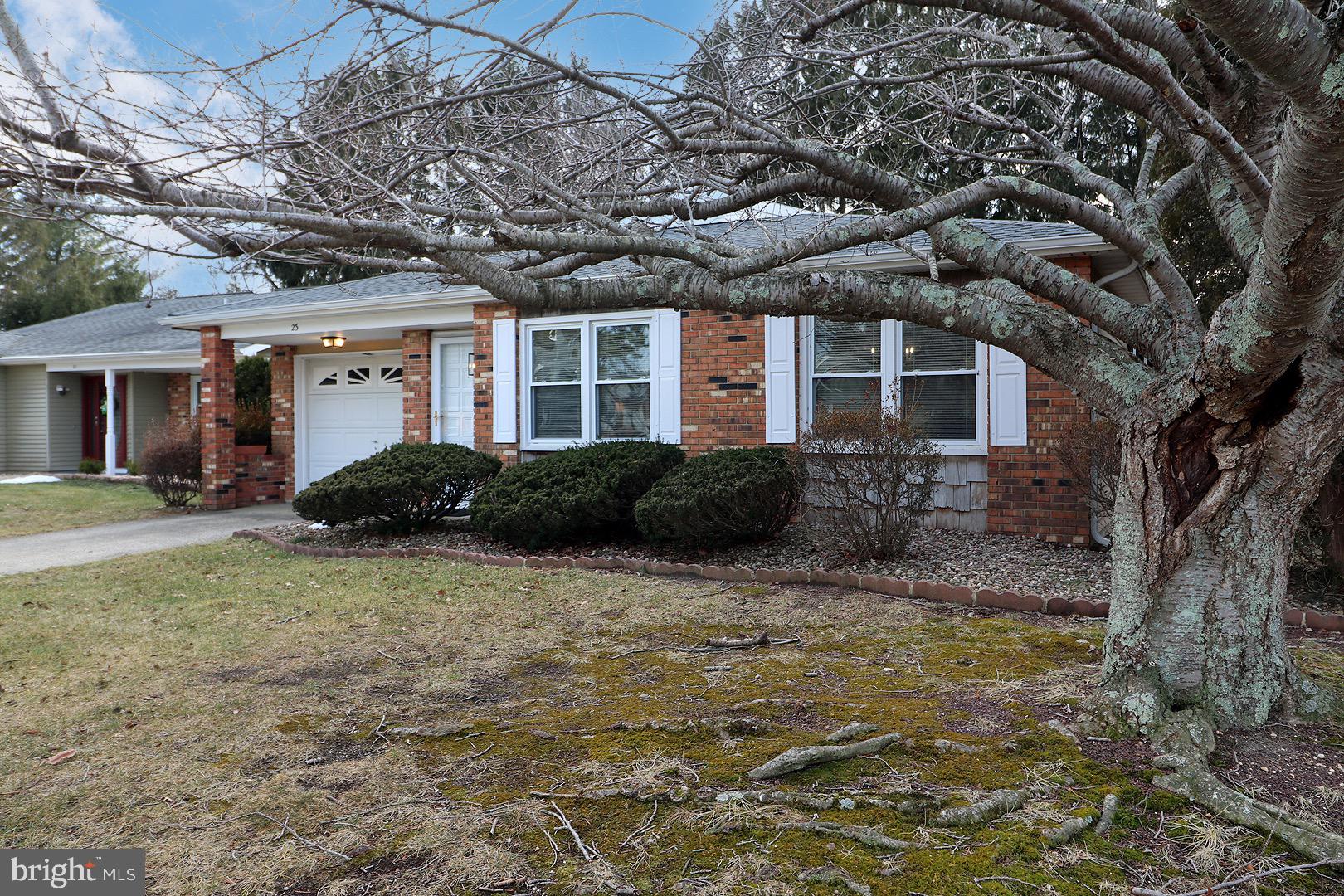 23 Abbey Road Brick, NJ 08723 - Photo 37 of 37 a front view of a house with a garden