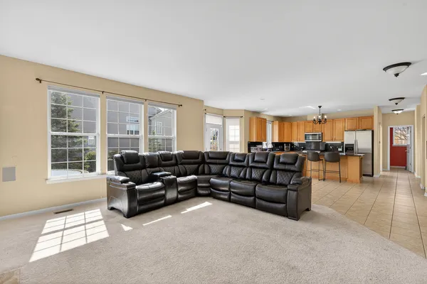 a living room with furniture and windows