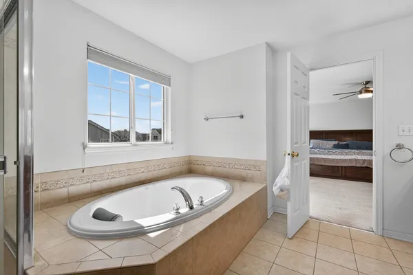 a bathroom with a tub and a sink