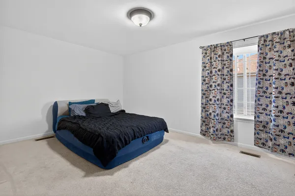 a living room with a couch and a walk in closet