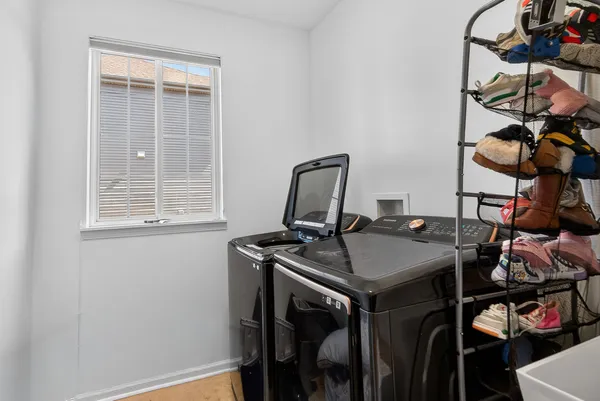a view of a workspace with furniture and window