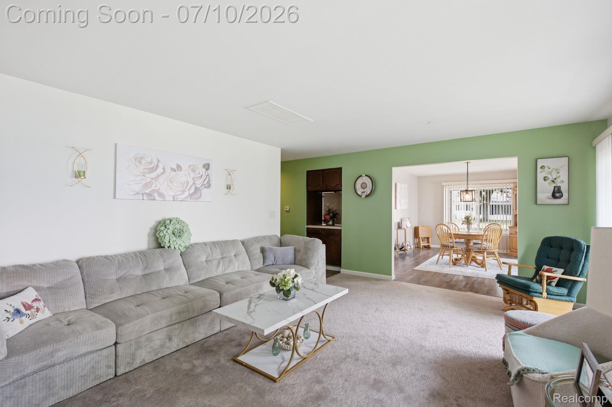 1501 River Road, Unit 301 St. Clair, MI 48079 - Photo 17 of 32 Spacious living area featuring light carpeting and an archway leading to the dining room