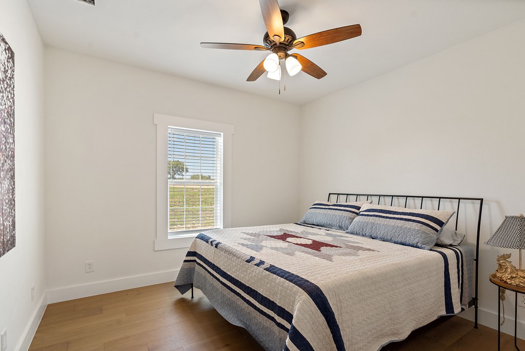 784 Ranch Road 2721 Johnson City, TX 78636 - Photo 16 of 20 a bedroom with a bed and a window