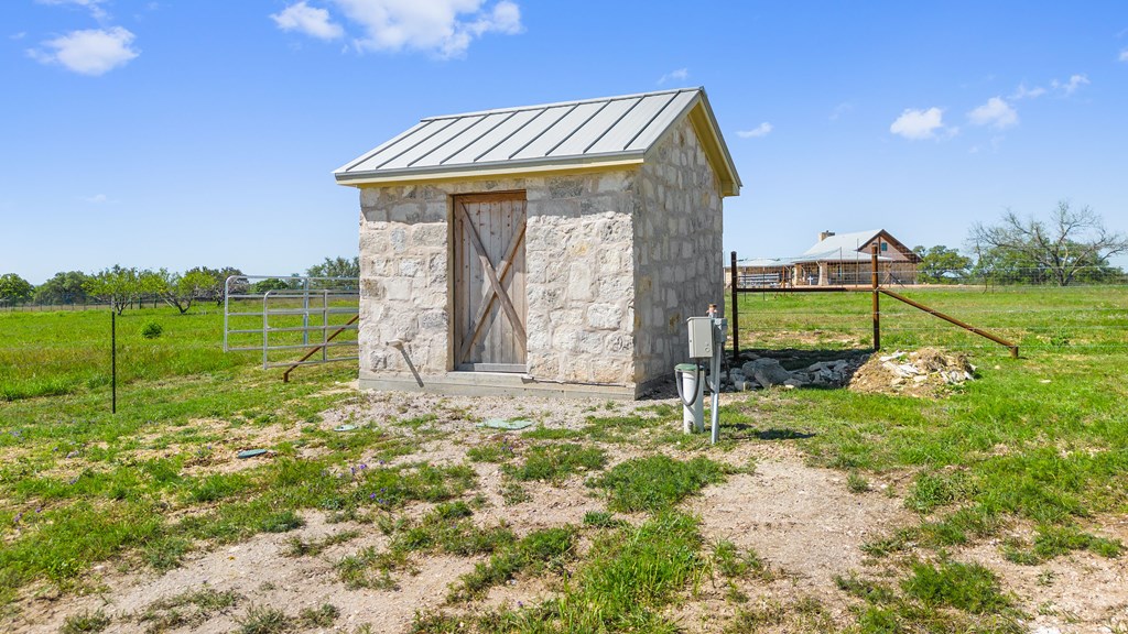 784 Ranch Road 2721 Johnson City, TX 78636 - Photo 18 of 20 a front view of a house with garden