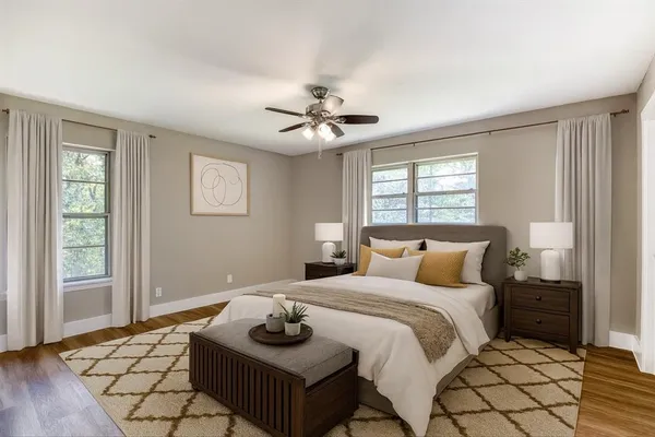 a bedroom with bed and window