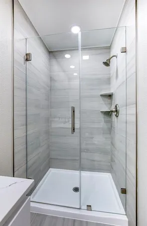 a bathroom with a shower and a bathtub