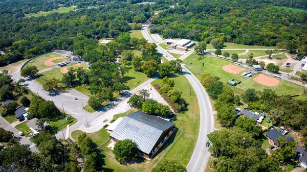 an aerial view of residential house with outdoor space and swimming pool