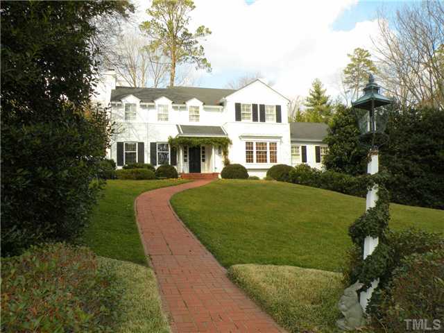 2528 York Road Raleigh, NC 27608 - Photo 1 of 12 a front view of a house with a yard table and chairs