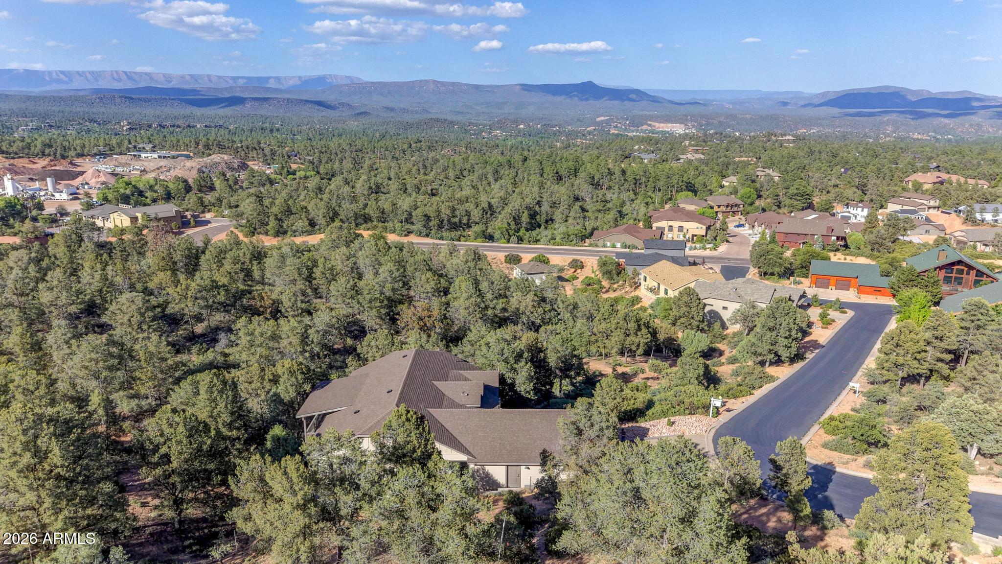1908 East Starlight Pass Payson, AZ 85541 - Photo 3 of 30 an aerial view of green landscape with trees houses and mountain view