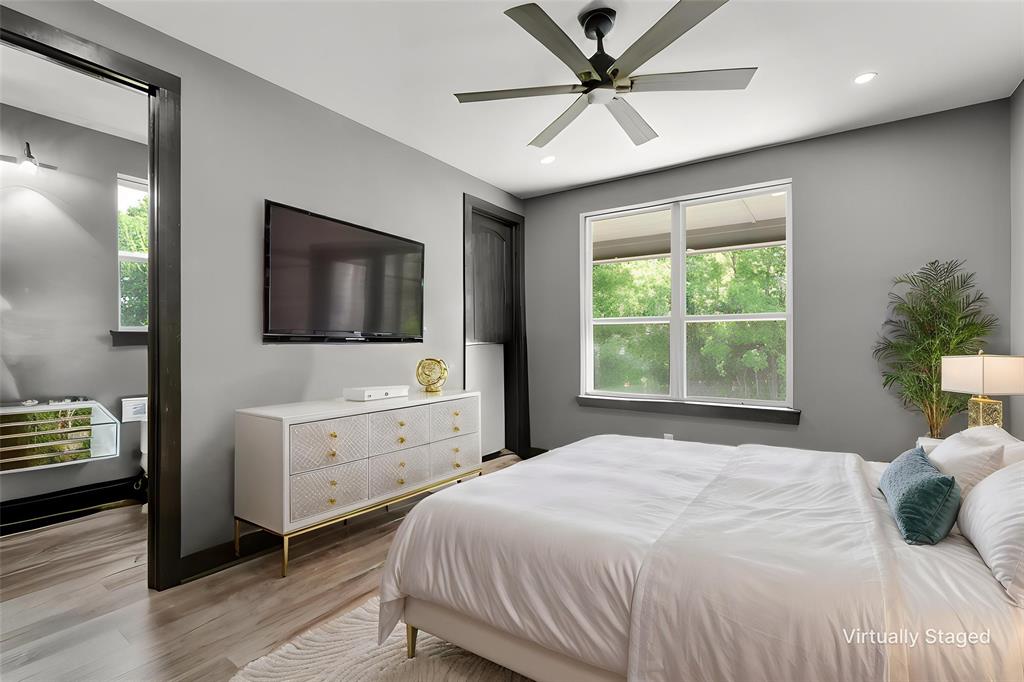 7899 County Road 623 Blue Ridge, TX 75424 - Photo 15 of 39 a bedroom with a large bed and a flat screen tv