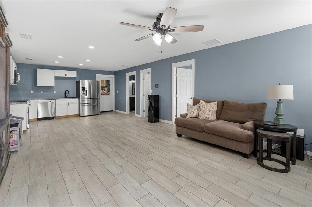 7899 County Road 623 Blue Ridge, TX 75424 - Photo 27 of 39 a living room with furniture and a chandelier