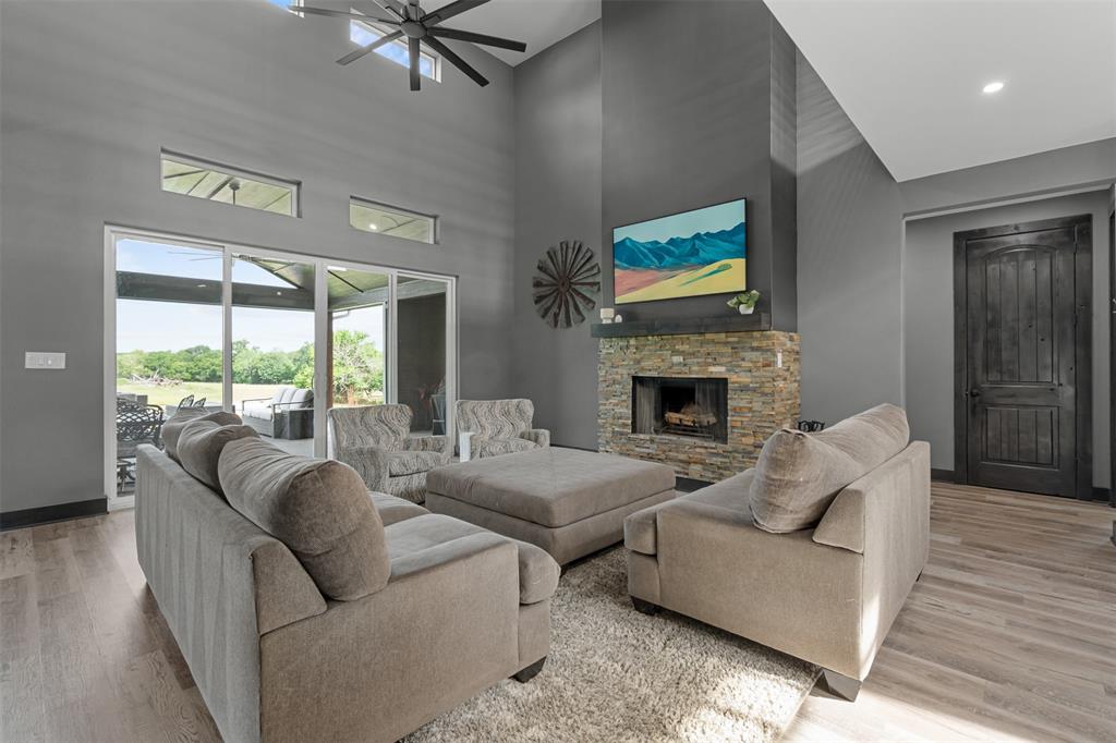 7899 County Road 623 Blue Ridge, TX 75424 - Photo 4 of 39 a living room with furniture fireplace and a large window