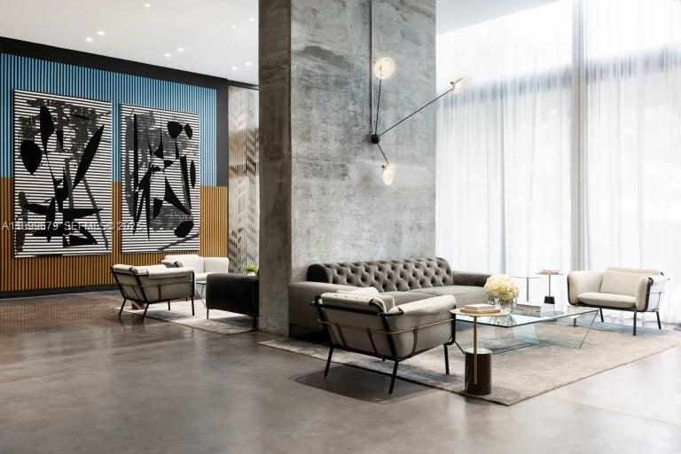 398 Northeast 5th Street, Unit 4409 Miami, FL 33132 - Photo 16 of 30 a living room with furniture and a large mirror