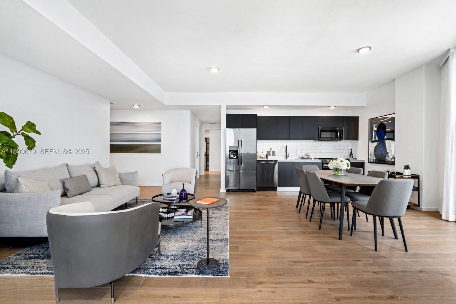 398 Northeast 5th Street, Unit 4409 Miami, FL 33132 - Photo 4 of 30 a living room with furniture and view of kitchen