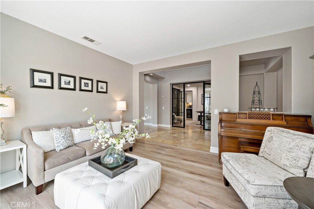 34150 Starpoint Street Temecula, CA 92592 - Photo 11 of 65 a living room with furniture and a wooden floor