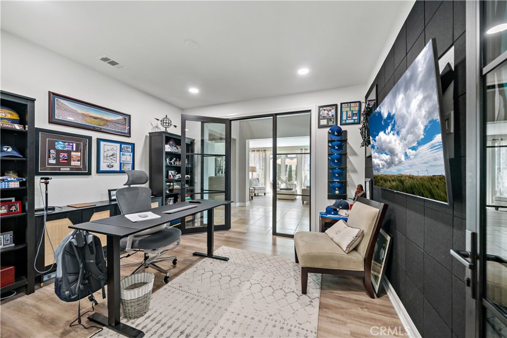 34150 Starpoint Street Temecula, CA 92592 - Photo 13 of 65 a living room with furniture flat screen tv and a large window