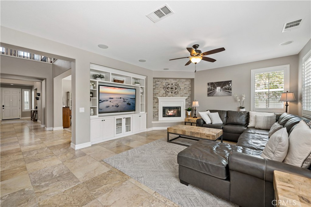 34150 Starpoint Street Temecula, CA 92592 - Photo 16 of 65 a living room with furniture and a flat screen tv