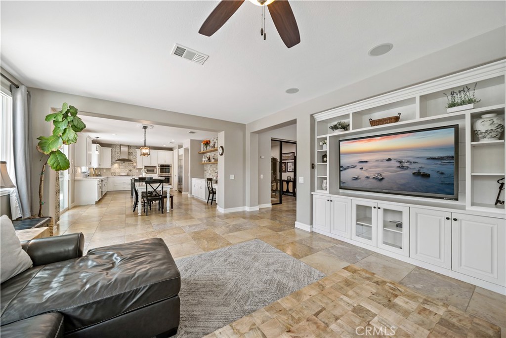 34150 Starpoint Street Temecula, CA 92592 - Photo 18 of 65 a living room with furniture and a flat screen tv