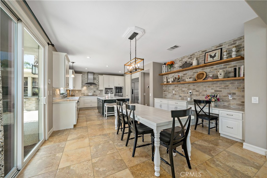 34150 Starpoint Street Temecula, CA 92592 - Photo 20 of 65 a view of a dining room with furniture and wooden floor
