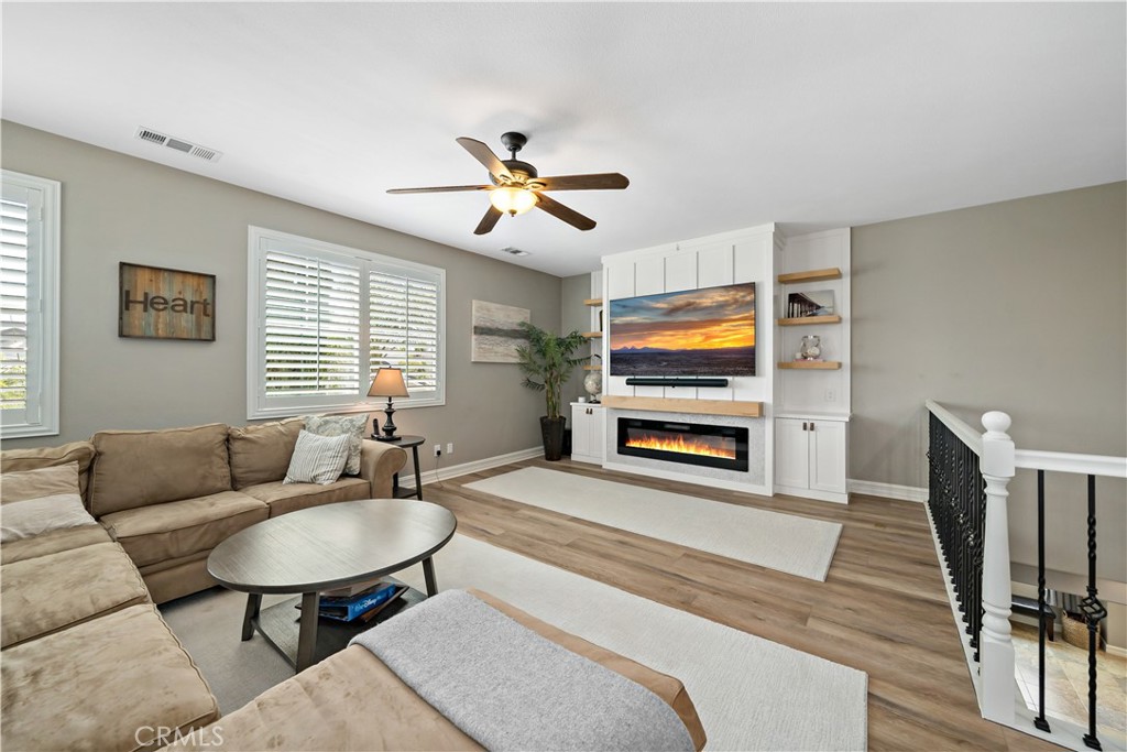 34150 Starpoint Street Temecula, CA 92592 - Photo 31 of 65 a living room with furniture and a flat screen tv