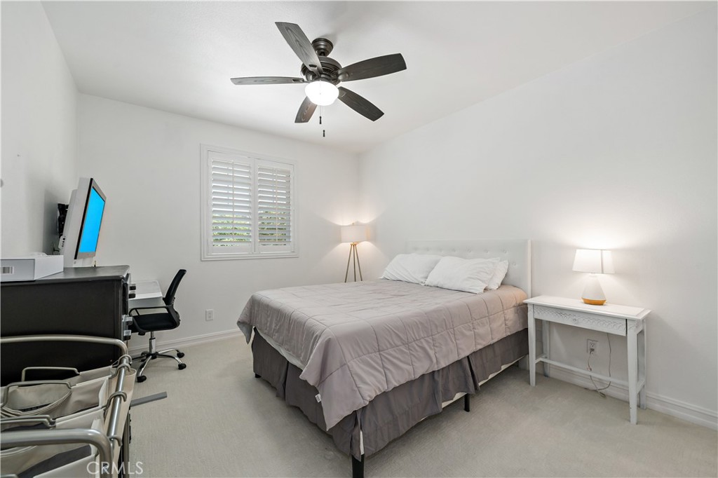 34150 Starpoint Street Temecula, CA 92592 - Photo 44 of 65 a bedroom with a bed a desk and chair