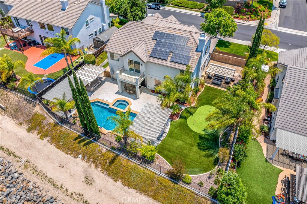 34150 Starpoint Street Temecula, CA 92592 - Photo 51 of 65 an aerial view of a house with a garden and outdoor seating