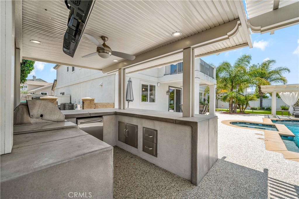 34150 Starpoint Street Temecula, CA 92592 - Photo 53 of 65 a view of a kitchen with stainless steel appliances wooden floor and chandelier