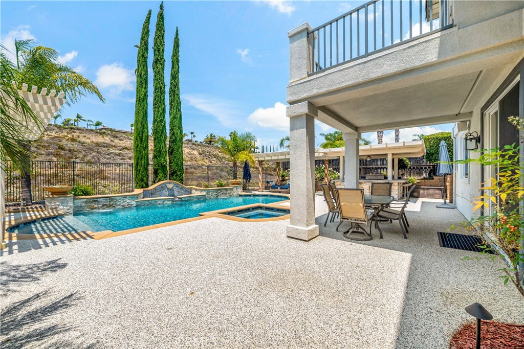 34150 Starpoint Street Temecula, CA 92592 - Photo 59 of 65 a view of a patio with a table chairs and a patio