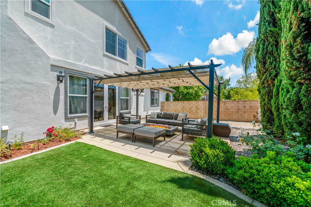 34150 Starpoint Street Temecula, CA 92592 - Photo 60 of 65 a view of a house with backyard sitting area and garden