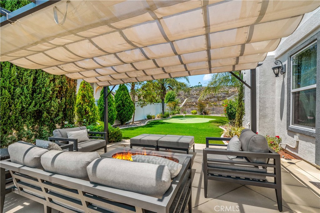 34150 Starpoint Street Temecula, CA 92592 - Photo 62 of 65 a view of a patio with couches fire pit and a patio
