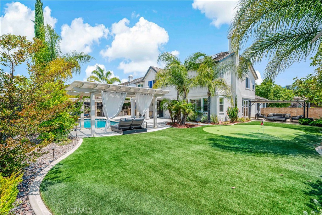 34150 Starpoint Street Temecula, CA 92592 - Photo 63 of 65 a view of a house with a big yard plants and palm trees