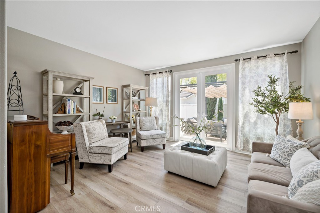 34150 Starpoint Street Temecula, CA 92592 - Photo 9 of 65 a living room with furniture and a large window
