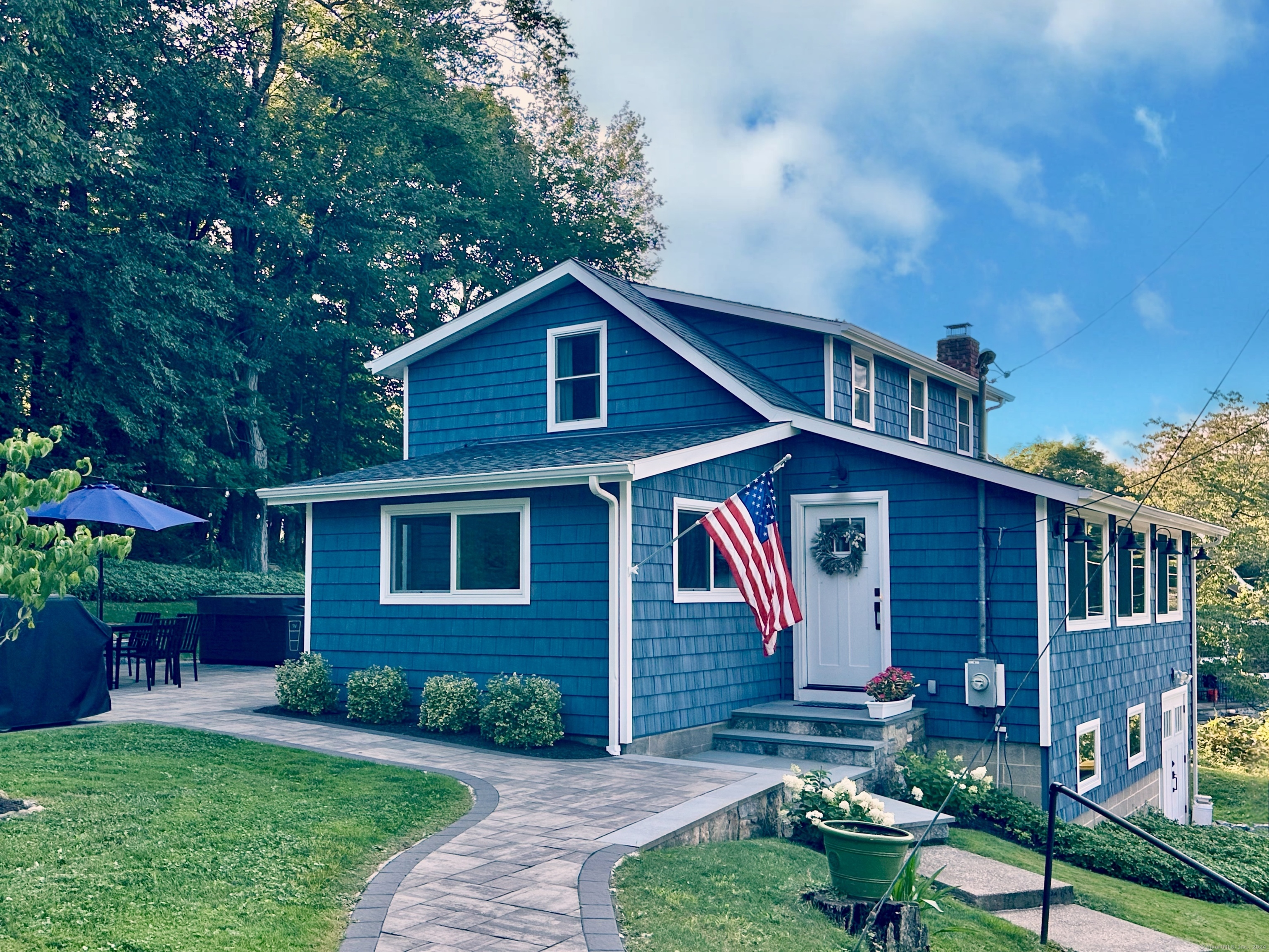 41 Candlewood Drive New Fairfield, CT 06812 - Photo 1 of 16 a front view of a house with garden