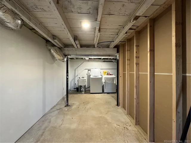 a view of a hallway with wooden walls